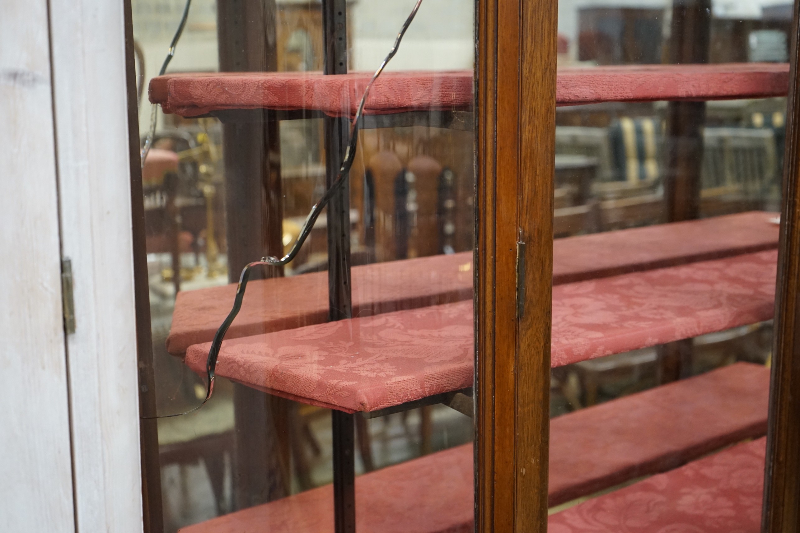 A Victorian mahogany shop display cabinet on later base, width 150cm, depth 32cm, height 209cm